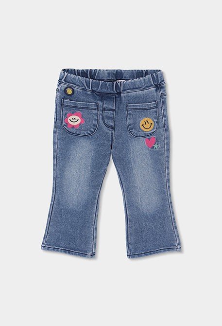 Girl's blue denim trousers with floral patches